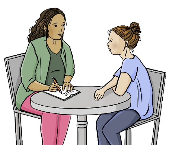 Zwei Frauen sitzen an einem Tisch